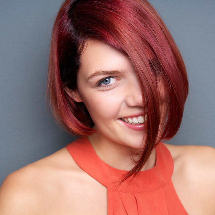 young-woman-laughing-with-red-hair-PW4ZAFH